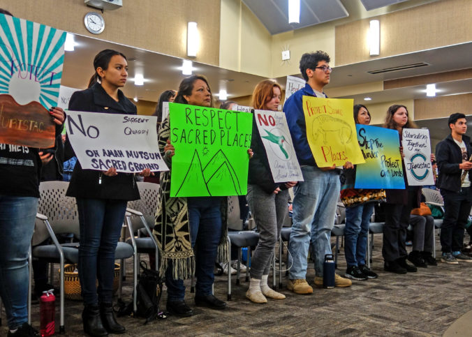 Tribal mmbers and students hold signs in support of a resolution to protect Juristac in Morgan Hill in January 2020